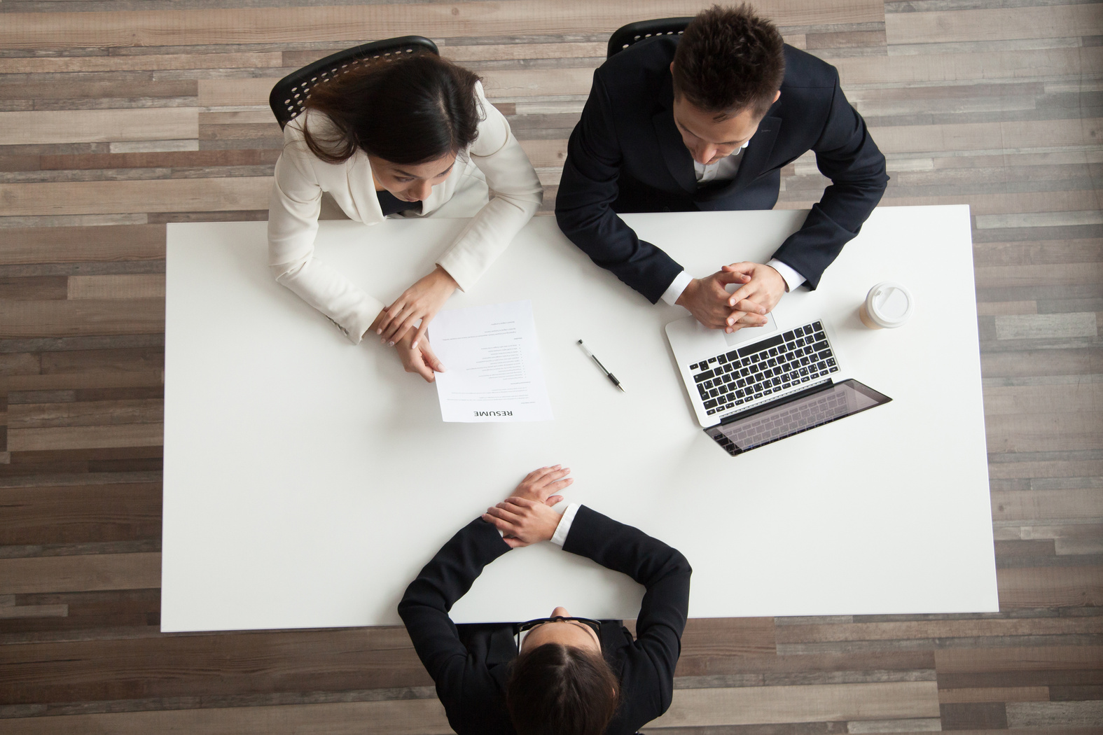 Hr managers interviewing female job applicant, top view from above